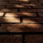 Soft light patterns on obsidian texture